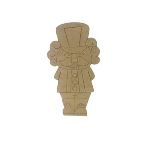 May include: A brown wooden nutcracker cutout with a black outline. The nutcracker has a hat, mustache, and a smiling face.
