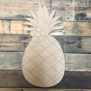 May include: Unfinished wooden pineapple cutout with a flower on top. The pineapple has a diamond pattern on the body.