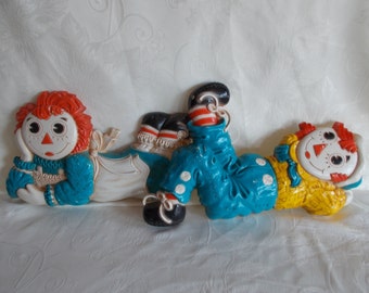 Vintage Raggedy Ann And  RaggedyAndy Plastic Wall Hangings