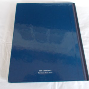 May include: A dark blue hardcover book with the text "ISBN 1-57793-403-3 Printed in Hong Kong" on the back cover.