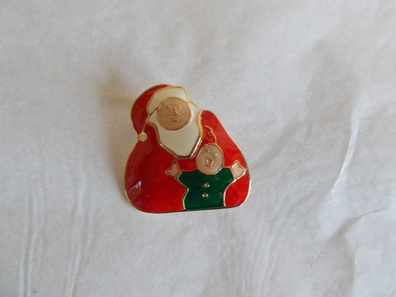 Vintage Metal Enamel Santa Holding Baby Brooch - image 1