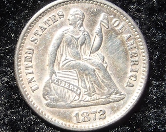 1872 Half Dime, Seated Liberty,  Obv. MS 65, Rev.  MS 65 with die break on reverse leaf