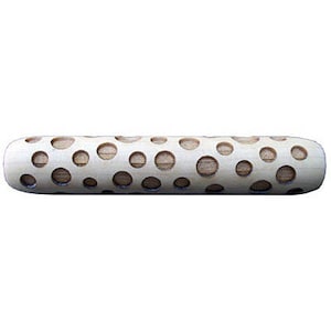 May include: A wooden rolling pin with a polka dot pattern. The rolling pin is light brown and has a smooth surface.