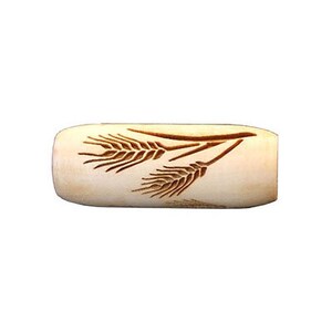 May include: A wooden rolling pin with a wheat design carved into the surface.