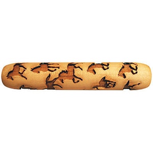 May include: A wooden rolling pin with a design of horses running in a field. The rolling pin is brown and has a smooth surface.