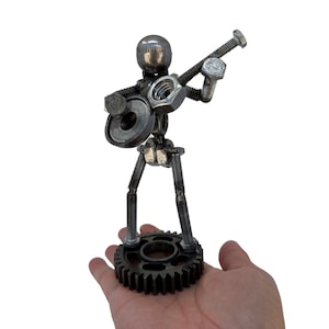Guitar Player 6 inches tall. 100% Handmade All recycled materials. A Perfect gift for people who love playing guitar or any occasion