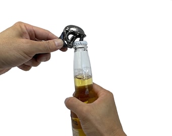 An unique beer opener, check out this Alien bottle opener. Made out of recycled material. 100% Handmade. 5" long. A perfect gift for men.