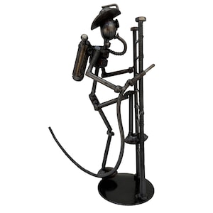 Firefighter 9 inches high 100% Handmade. Made out of scrap metal. A incredible gift for Firefighters