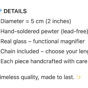 May include: Text on a white background reads "DETAILS" followed by bullet points describing a product. The diameter is approximately 2 inches. It is hand-soldered pewter, lead-free, with real glass and a functional magnifier. A chain is included.