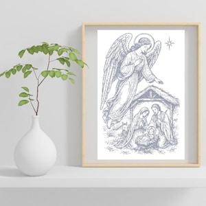May include: A framed print featuring a detailed illustration of the Nativity scene. The artwork depicts an angel, the Holy Family, and a star, all rendered in a grayscale color palette. The frame is a light wood color.
