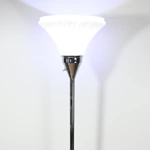May include: A chrome floor lamp with a white frosted glass shade. The lamp has a simple design and a long, slender stem.