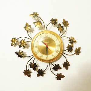 MCM Era Electric United Maple Leaves Floral Metal Hanging Wall Clock
