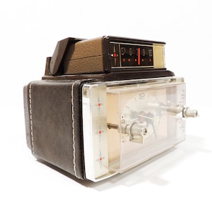 Collectible MCM Era General Electric Leather Wrapped Micro Radio Alarm Clock