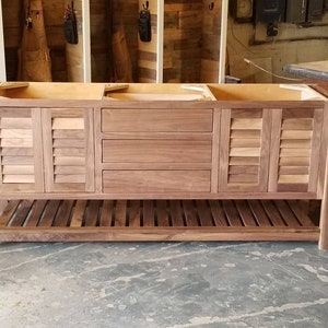 Black walnut vanity with louvered doors