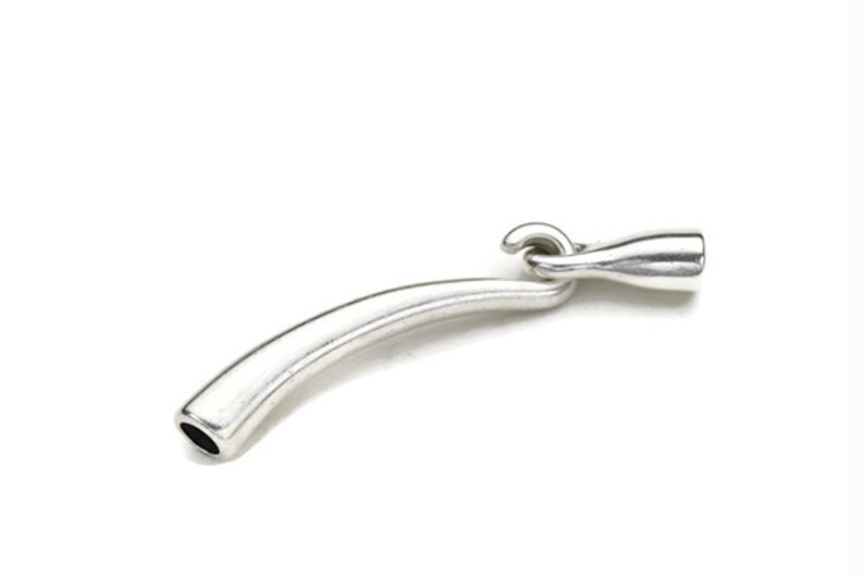 May include: Silver-toned metal jewelry clasp with a curved tube and a hook closure.
