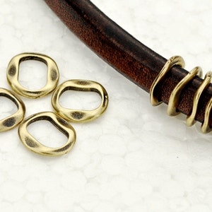 5 Flat Wavy Spacers fits all 10 x 6mm Licorice Leather Cord - Antique Brass