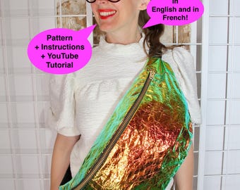 Pode incluir: Uma pochete holográfica com zíper dourado e alça preta. A bolsa é iridescente, com cores que mudam de verde para laranja. O texto em um balão rosa diz "Pattern + Instructions + YouTube Tutorial". Outro balão diz "In English and in French!"