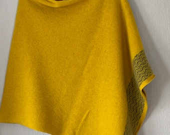 Poncho soft merino lambswool piccalilli yellow with wavy border in uniform grey