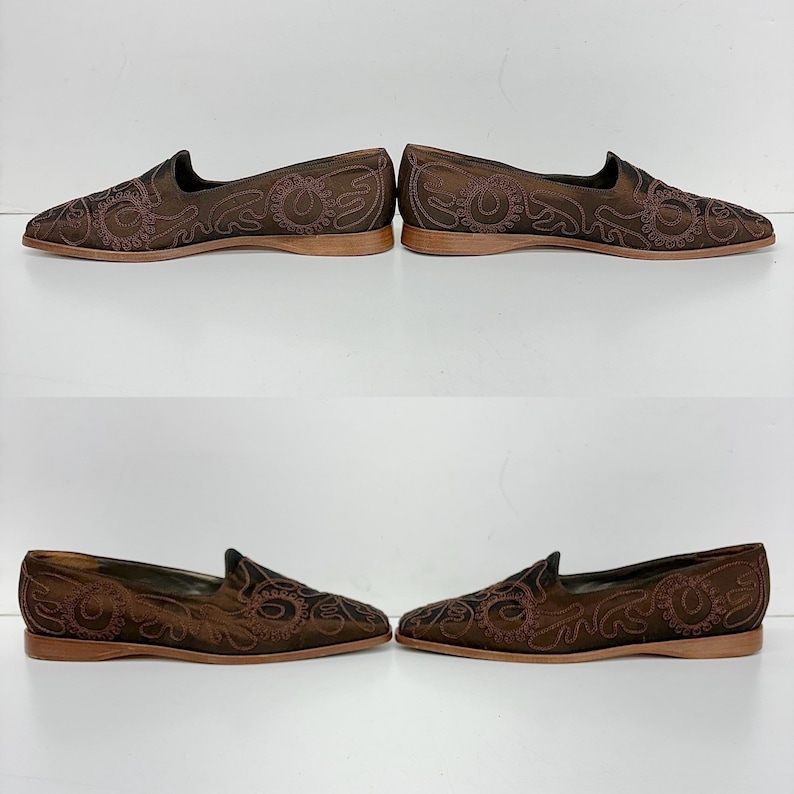 May include: Four pairs of brown slip-on shoes with detailed embroidered floral patterns. The shoes feature a low profile, a rounded toe, and a thin, light brown sole. The embroidery is a darker brown, creating a contrasting design.