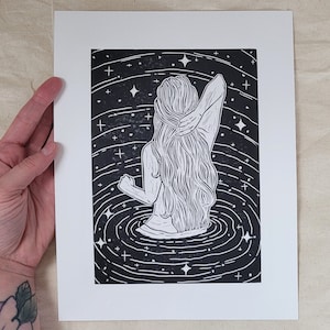 Under The Stars - hand-printed lino-cut block print depicting a swimmer going for a dip in a starry, glittery ocean at night - beach, surf