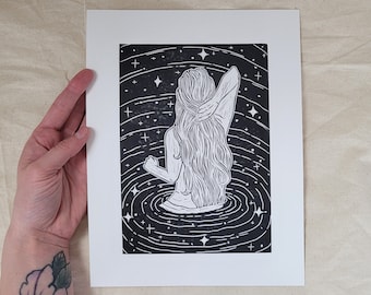 Under The Stars - hand-printed lino-cut block print depicting a swimmer going for a dip in a starry, glittery ocean at night - beach, surf
