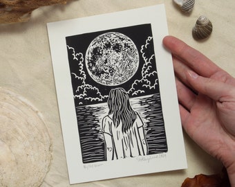 By The Moon - hand-printed lino-cut/block print depicting a figure looking out at the moonlit ocean - beach, surf, swim, printmaking, sea