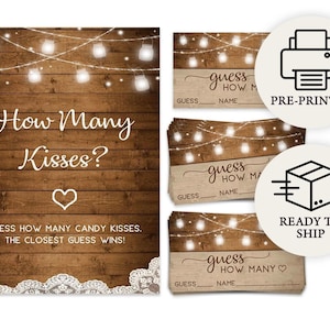 May include: A rustic wooden sign with the text "How Many Kisses?" and a heart. The sign is for a game where guests guess the number of candy kisses. Includes pre-printed guess cards and a "Ready to Ship" icon.