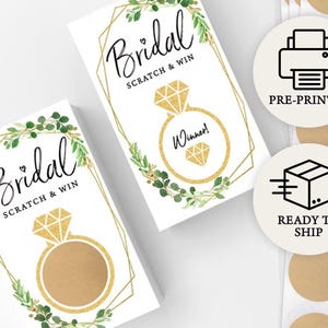 May include: A set of printable bridal shower scratch off cards with a gold ring and diamond design. The cards say "Bridal Scratch & Win" and "Winner!" The cards are pre-printed and ready to ship.