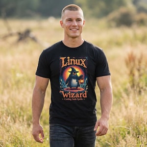 May include: Black t-shirt with a graphic of a penguin wizard holding a lantern, with the words "Linux Wizard - Casting Sudo Spells". The design is in shades of blue, orange, and yellow.