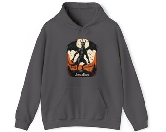 May include: A dark gray hoodie with a graphic print of the Jersey Devil, a mythical creature with wings and horns, standing in a forest setting with a full moon in the background. The text "Jersey Devil" is printed below the image.