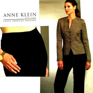 May include: A sewing pattern envelope for an Anne Klein Vogue American Designer outfit featuring a long-sleeved, button-front jacket with a textured brown and black pattern, paired with solid black trousers. The pattern number is V1064, size BB.