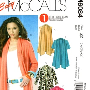 May include: A sewing pattern for a cardigan with four different styles. The pattern is for sizes large, extra large, and extra extra large. The pattern is called "1 Hour Cardigan" and is from McCall's.