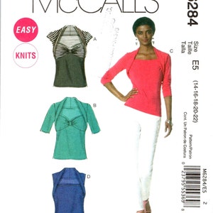 May include: Sewing pattern for a knit top with a bow detail. The pattern includes four different styles of tops, with a black and white striped top, a teal top, a blue top, and a pink top with a matching cardigan. The pattern is for sizes 14-16-18-20-22. The pattern is labeled "Easy" and "Knits".