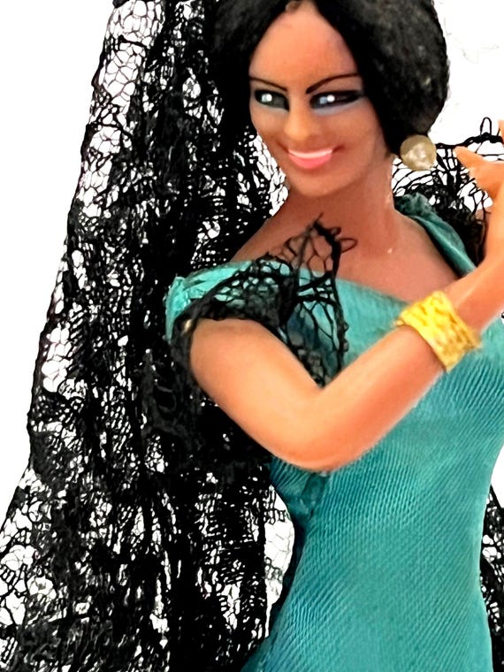 the green dress is very pretty in spanish FLAMENCO DOLL, Miniature Flamenco Dancer Beautiful Blue Lace | Polka Dot Dress, Detailed Doll, Approx 8