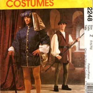May include: A vintage sewing pattern for a Renaissance costume. The pattern is for a large size and includes instructions for making a tunic, pants, and a hat. The pattern is printed on yellow paper with a black and white illustration of two men wearing the costume.