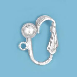 May include: A silver-colored earring clip-on component with a ball and a curved, hinged design. The clip has a small loop and a decorative, leaf-like element. The background is a solid light blue.
