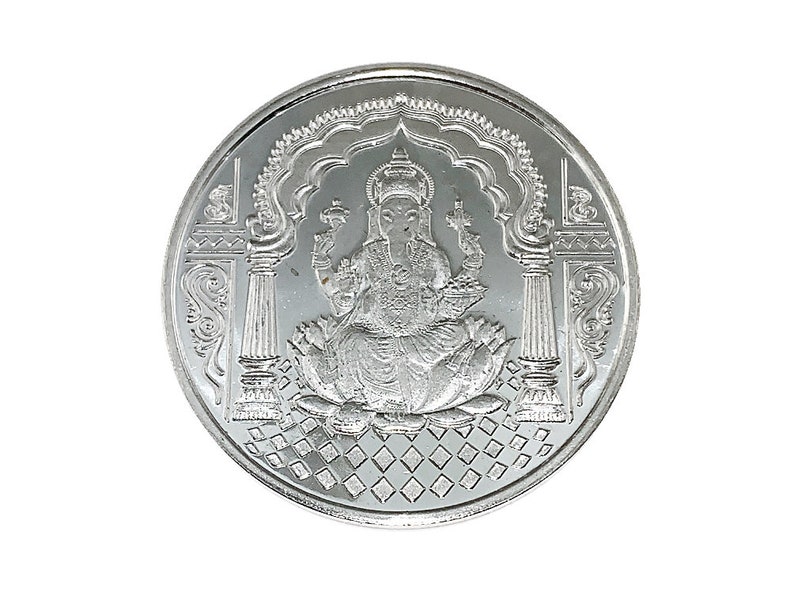 Fine Silver Ganesh coin depicting Ganesh , the elephant god in the center, Ganesh Pure silver coin in 10 gm for diwali, puja wedding return gift. The coin features intricate detailing and Sanskrit text.  It's a round, silver-Silver collectible item, ideal for religious or cultural purposes. The design showcases the god in a seated position on a lotus flower,
Ganesh Pure silver coin fine silver 999 A silver coin with a raised image of the Hindu deity Ganesha sitting on a lotus flower.