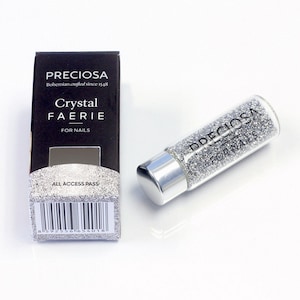 May include: A small silver bottle of Preciosa Crystal Faerie nail glitter. The bottle has a silver cap and a label that says "Preciosa" and "For Nails".