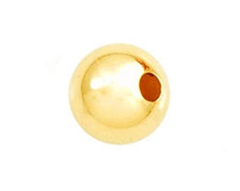 May include: A single, shiny gold-colored bead with a smooth surface and a small hole. The bead is spherical and appears to be made of metal. The background is plain white.