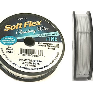 May include: A spool of white Soft Flex Beading Wire, labeled "Original Flex Wire Fine" with a diameter of 0.014 inches and a length of 30 feet. The label also states that the wire is made for seed beads and freshwater pearls, and has a test strength of 10 lbs.