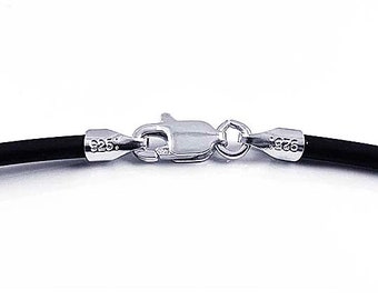 May include: A black leather cord necklace with a silver clasp. The clasp is marked with "925" on both sides.