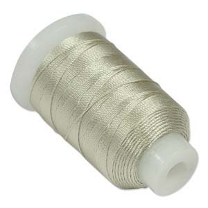 May include: A spool of light beige thread.