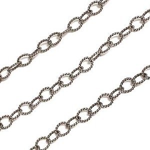 May include: A silver chain with a twisted rope design. The chain is made of small oval links.