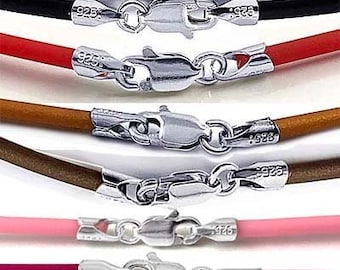 May include: A set of 12 colorful silicone cord necklaces with silver lobster clasps. Each necklace features a different color, including gray, blue, white, black, red, brown, pink, burgundy, green, and blue.