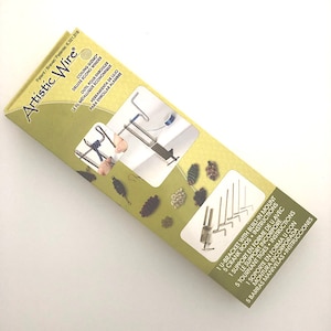 May include: A silver Artistic Wire Deluxe Econo Winder with a U-bracket, 5 crank rods, and instructions. The winder is used for coiling wire.