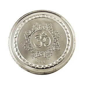 Fine Silver Ganesh coin depicting Ganesh , the elephant god in the center, Ganesh Pure silver coin in 10 gm for diwali, puja wedding return gift. The coin features intricate detailing and Sanskrit text.  It's a round, silver-Silver collectible item, ideal for religious or cultural purposes. The design showcases the god in a seated position on a lotus flower,
Ganesh Pure silver coin fine silver 999 A silver coin with a raised image of the Hindu deity Ganesha sitting on a lotus flower.