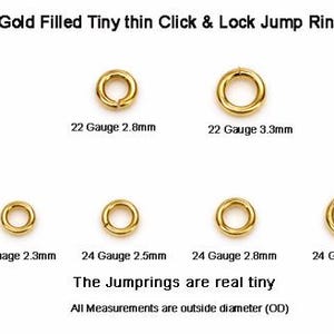 May include: Gold-filled jump rings in various sizes. The image shows six tiny, thin, click and lock jump rings. Measurements include 2.3mm, 2.5mm, 2.8mm, and 3.3mm outside diameters. Text on the image reads "The Jumprings are real tiny."