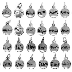 May include: A set of 24 silver charm pendants with various words and phrases, including "Believe", "Celebrate", "Courage", "Dream", "Faith", "Family", "Father", "Fortune", "Fun", "Happiness", "Health", "Honor", "Hope", "Inspire", "Jesus", "Joy", "Kindness", "Laugh", "Life", "Live", "Love", "Miracles", "Mother", "Peace", "Pray", "Purity", "Spirit", "Success", "Teach", "Trust", "Wisdom", and "Wish".