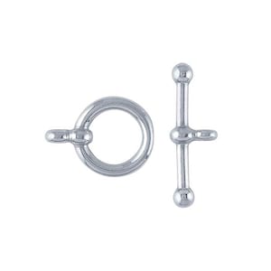 May include: Silver-toned metal toggle clasp with a round ring and a straight bar. The clasp is used for jewelry making.