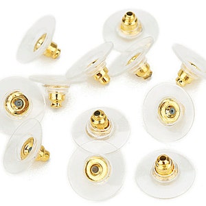 May include: A set of ten gold-toned earring backs with clear plastic backing. The backs are designed to secure earrings in place.